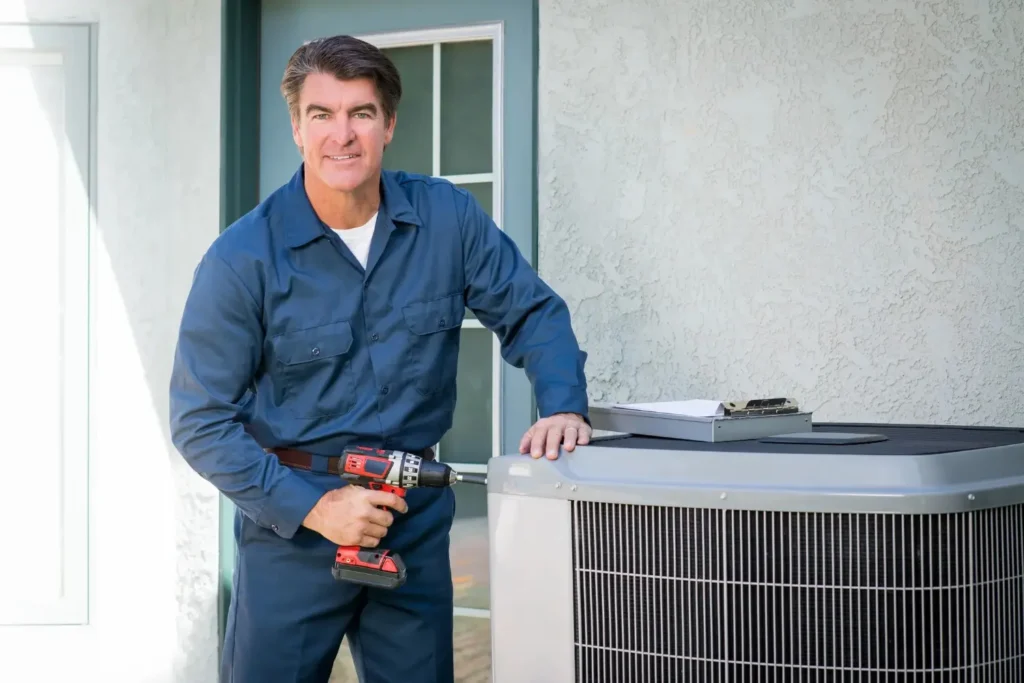 A Technician repairing an AC with a tool equipment