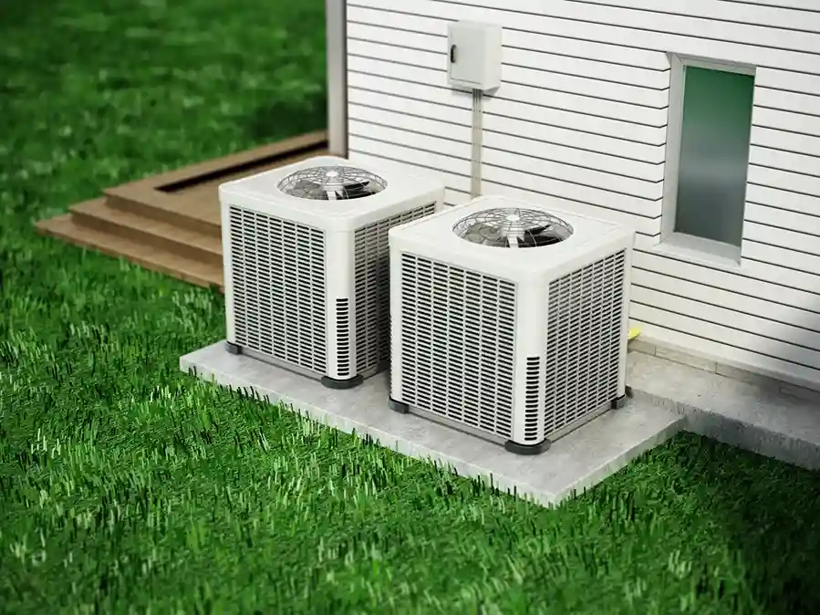 Two outdoor air conditioning units on a concrete slab beside a house with white siding, electrical box, and wooden steps leading to a deck